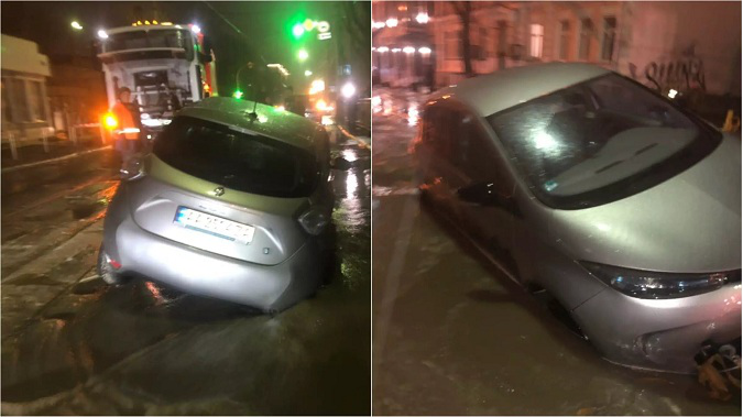 У Києві авто ледь не потонуло у гігантській калюжі (фото)
